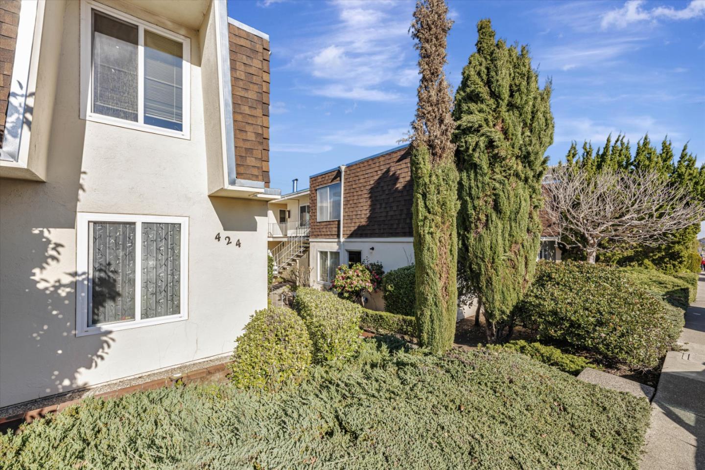424 Richmond Drive Millbrae, CA 94030 - Photo 3 of 22 a view of a house with a yard