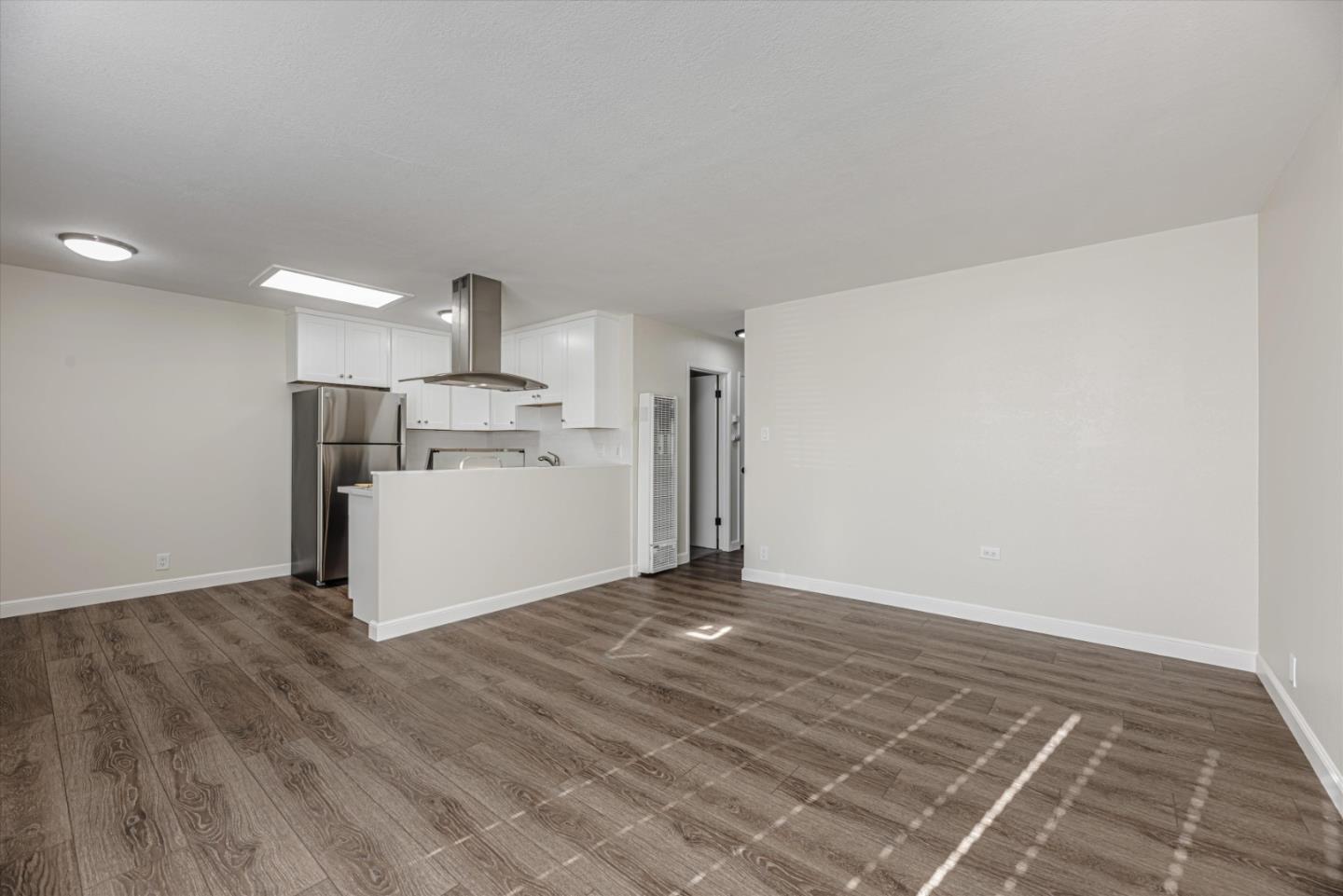 424 Richmond Drive Millbrae, CA 94030 - Photo 10 of 22 a view of a kitchen with a sink and a refrigerator