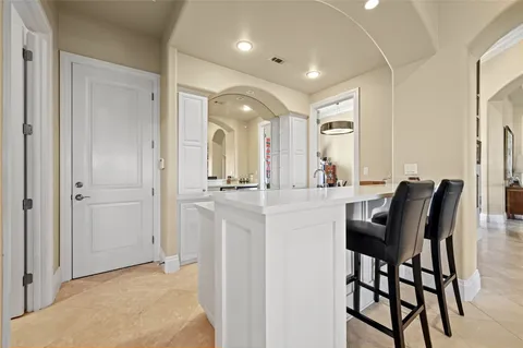 a bathroom with a granite countertop sink toilet a mirror and shower