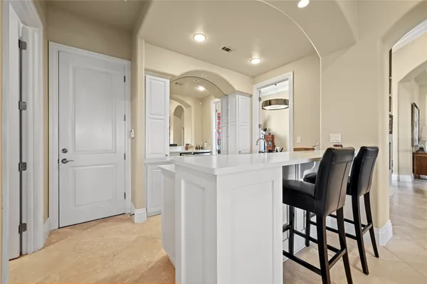 a bathroom with a granite countertop sink toilet a mirror and shower