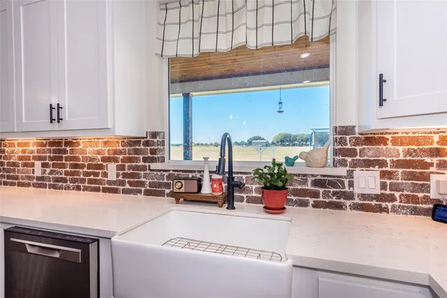 a kitchen with a stove and a white refrigerator