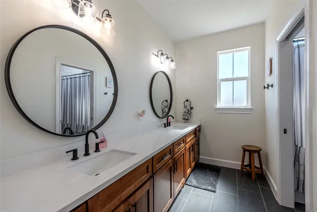a bathroom with a sink a mirror and a toilet