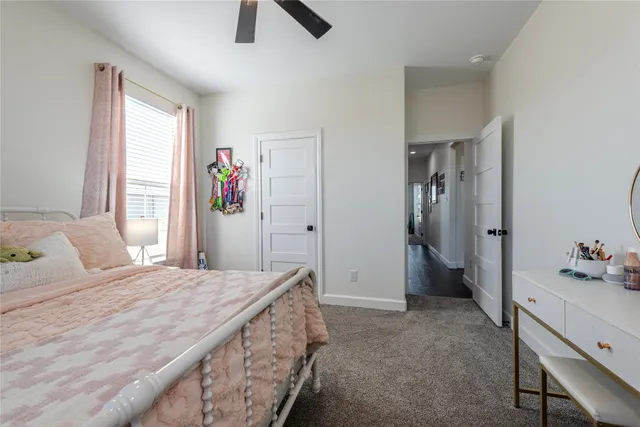 a bedroom with a bed and a dresser