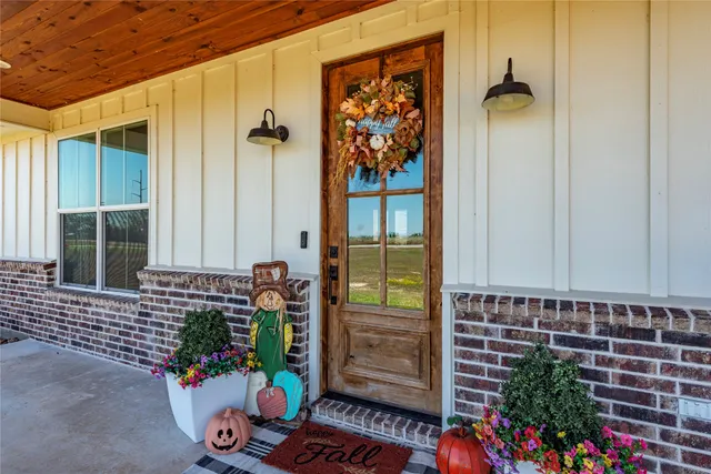 front view of a house with a potted plant
