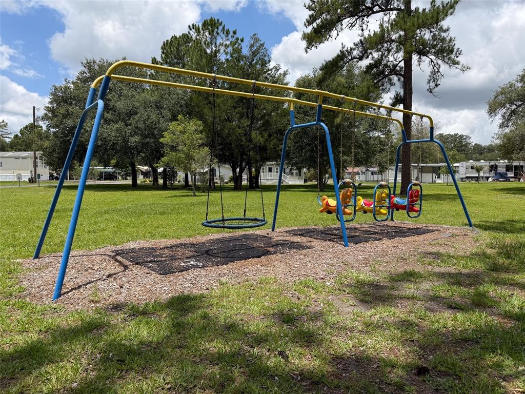 2092 Culbreath Road, Unit A42 Brooksville, FL 34602 - Photo 30 of 70 a view of a park with swings