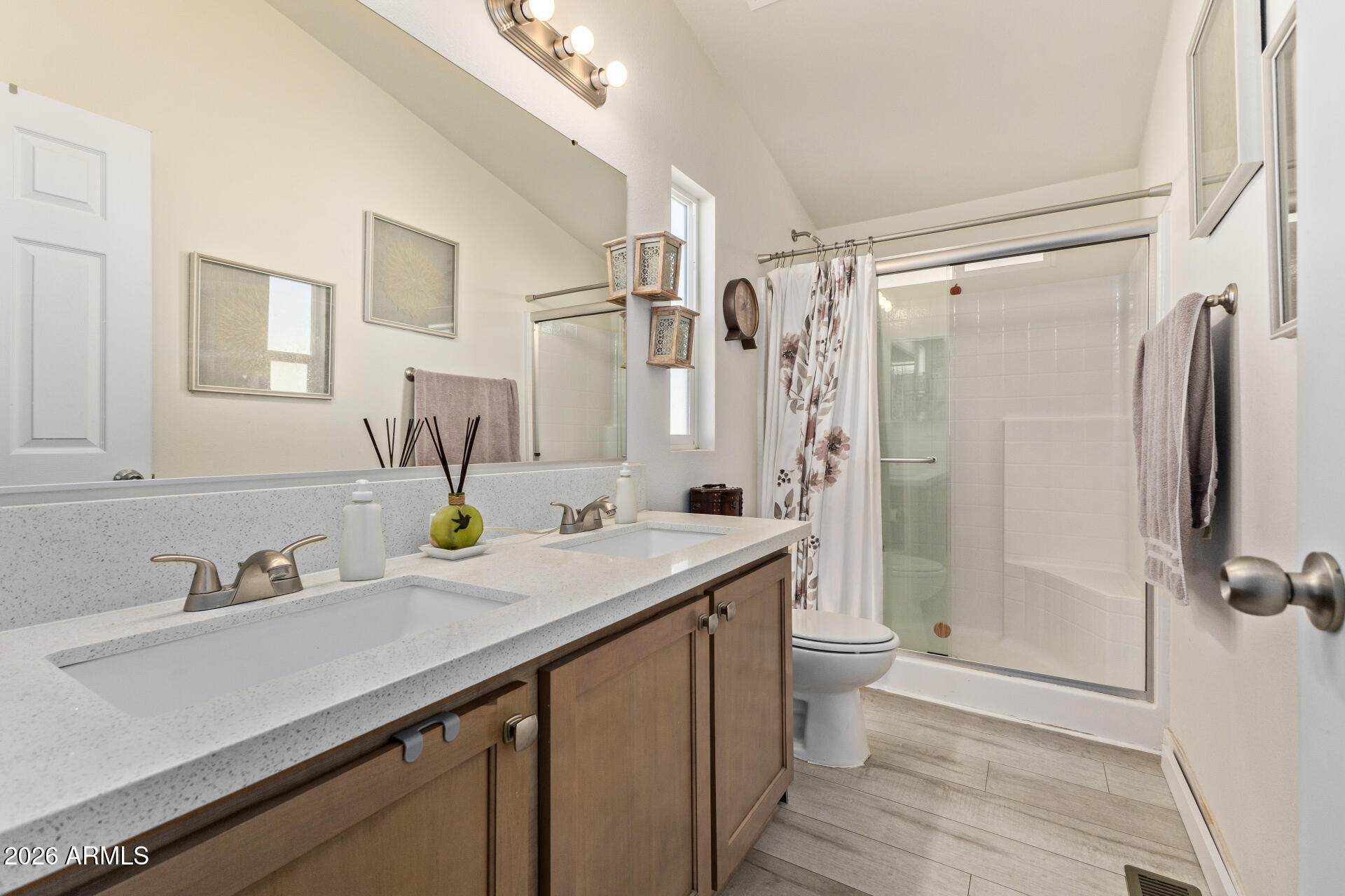 1101 South Ellsworth Road, Unit 153 Mesa, AZ 85208 - Photo 15 of 24 a bathroom with a sink a toilet and shower