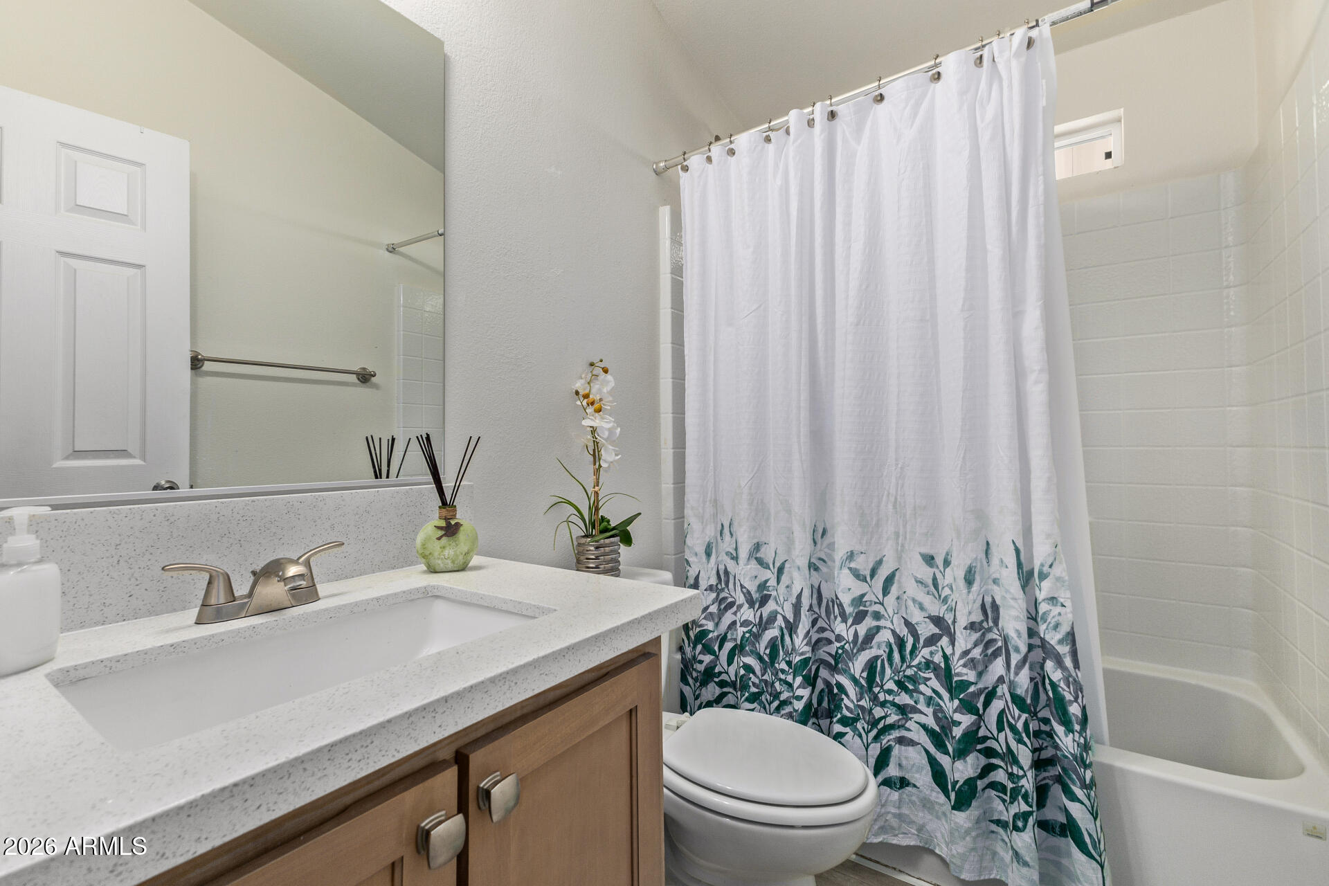 1101 South Ellsworth Road, Unit 153 Mesa, AZ 85208 - Photo 18 of 24 a bathroom with a granite countertop sink and a toilet