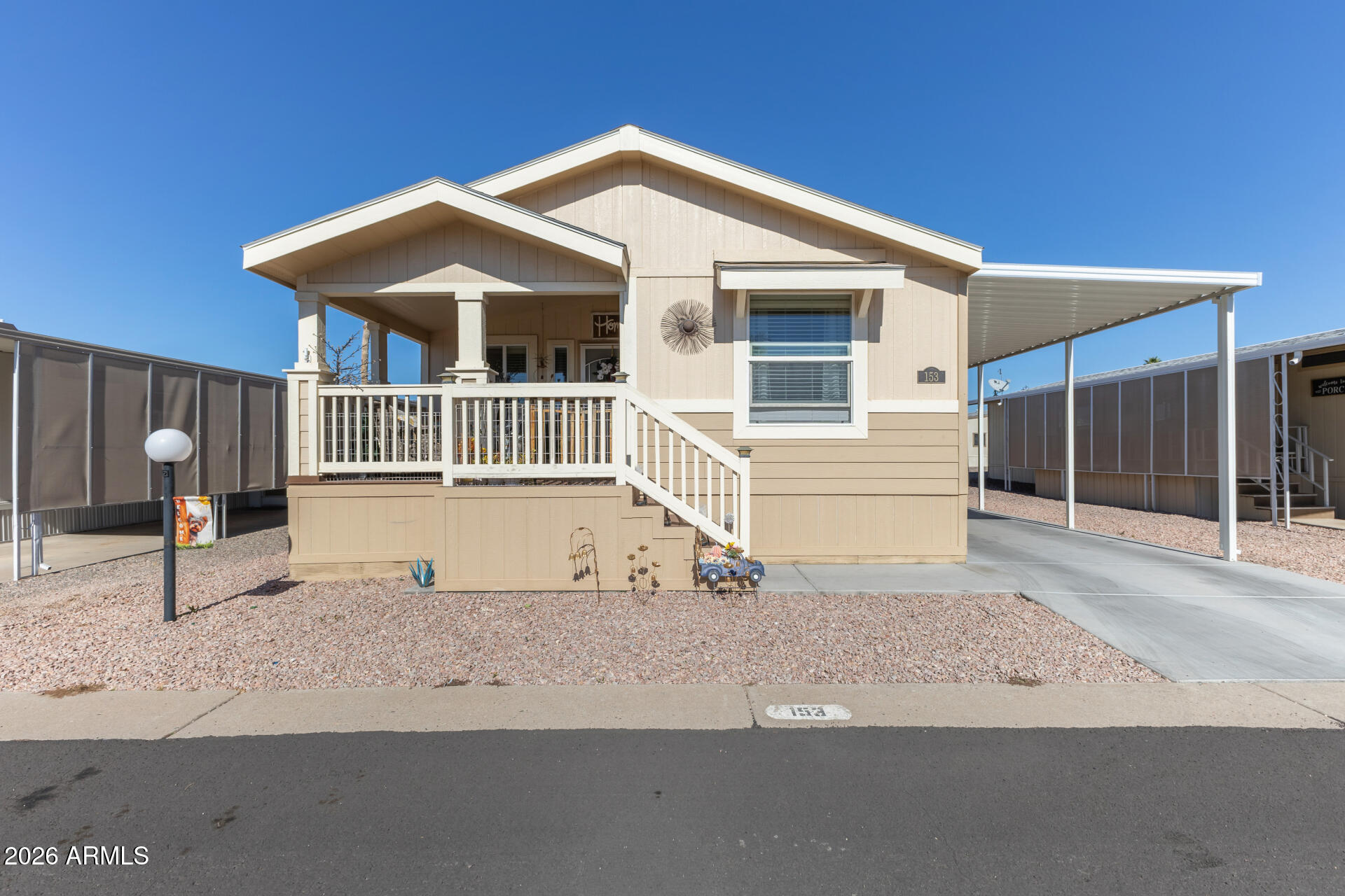1101 South Ellsworth Road, Unit 153 Mesa, AZ 85208 - Photo 2 of 24 a front view of a house with garage