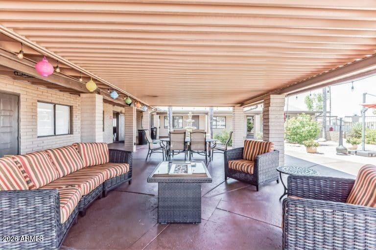 1101 South Ellsworth Road, Unit 153 Mesa, AZ 85208 - Photo 23 of 24 a living room with furniture and a large window