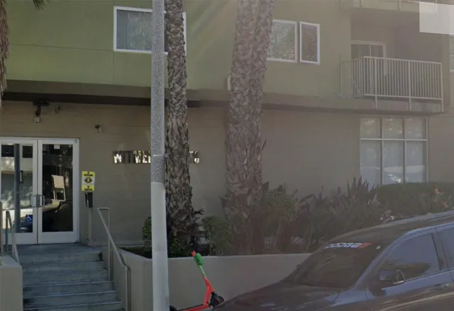 a bathroom with a shower and toilet
