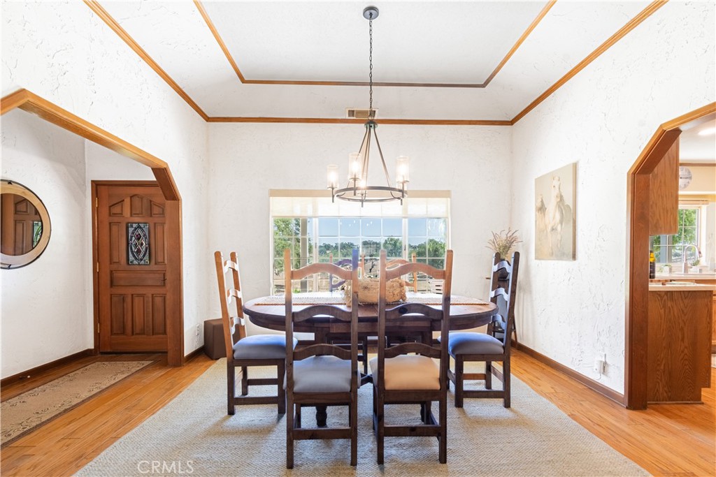 2085 Hanging Tree Lane Templeton, CA 93465 - Photo 6 of 33 Open entry looking into formal Dining Room with custom ceiling and wood trim and chandelier.