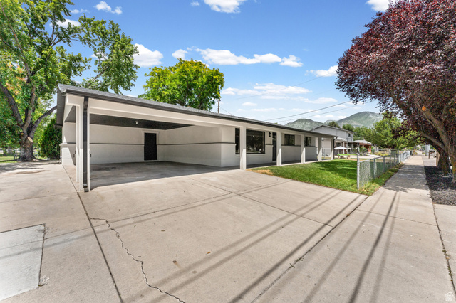 1898 West 600 South Provo, UT 84601 - Photo 27 of 32 Contemporary exterior featuring a carport, concrete driveway, and covered front entry