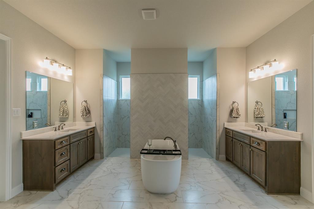 16833 Chapel Road Lorena, TX 76655 - Photo 13 of 40 a bathroom with a sink double vanity granite tub and a mirror