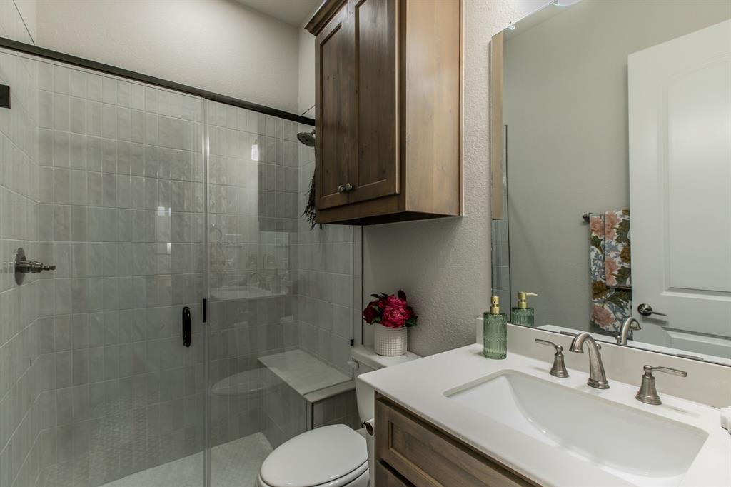 16833 Chapel Road Lorena, TX 76655 - Photo 18 of 40 a bathroom with a sink toilet and shower