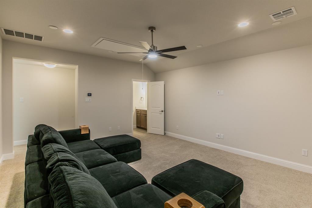 16833 Chapel Road Lorena, TX 76655 - Photo 21 of 40 a living room with furniture and a ceiling fan