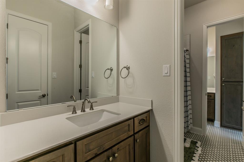 16833 Chapel Road Lorena, TX 76655 - Photo 24 of 40 a bathroom with a sink double vanity and a mirror