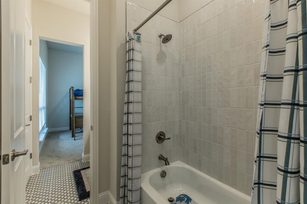 16833 Chapel Road Lorena, TX 76655 - Photo 25 of 40 a bathroom with a bathtub and a shower