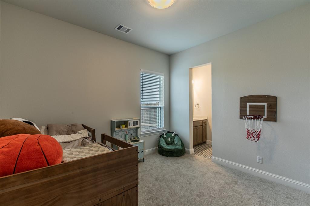 16833 Chapel Road Lorena, TX 76655 - Photo 27 of 40 a bedroom with a bed and a couch