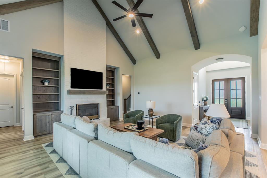 16833 Chapel Road Lorena, TX 76655 - Photo 3 of 40 a living room with furniture and a flat screen tv