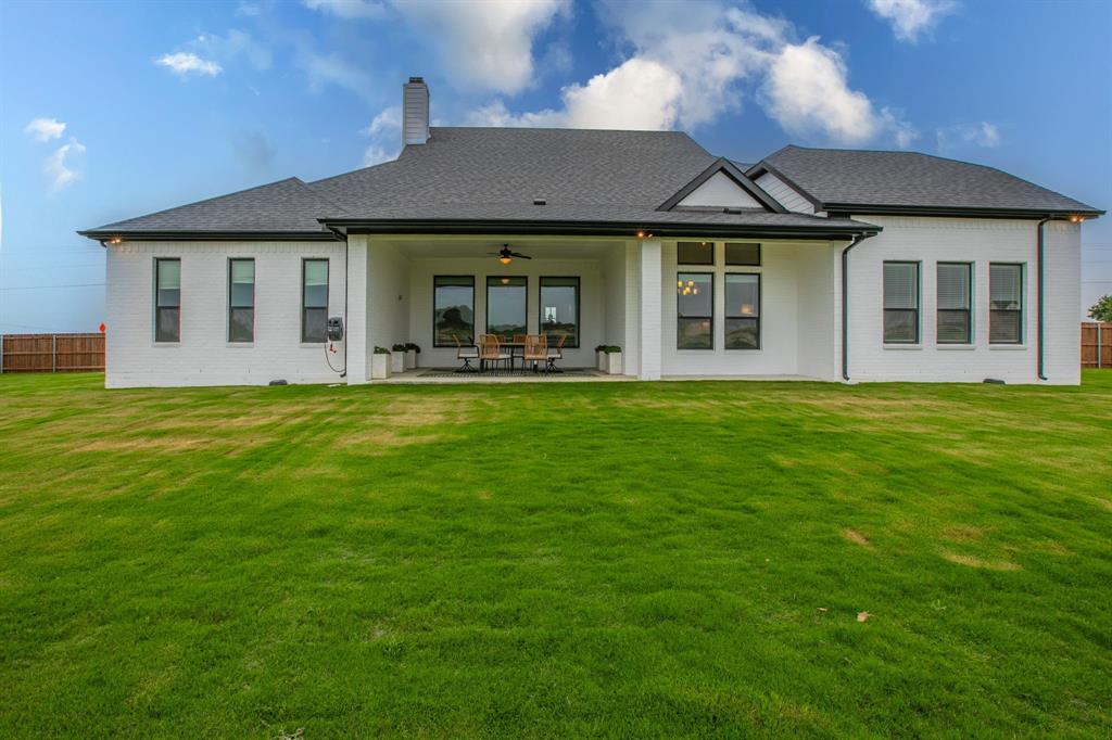 16833 Chapel Road Lorena, TX 76655 - Photo 34 of 40 a front view of a house with a garden and porch