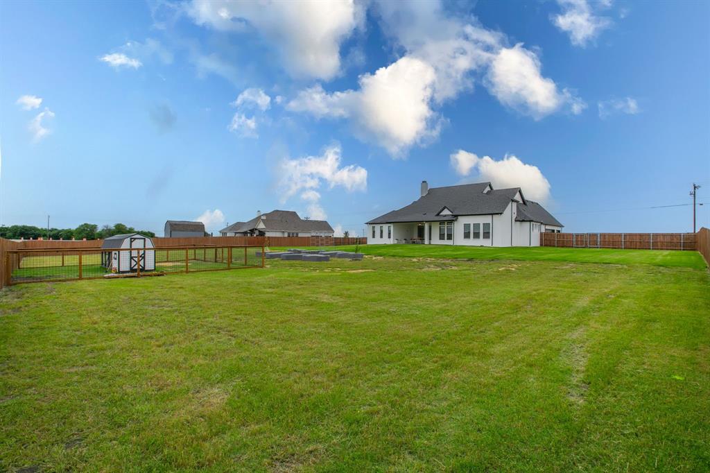 16833 Chapel Road Lorena, TX 76655 - Photo 35 of 40 a view of a house with a big yard