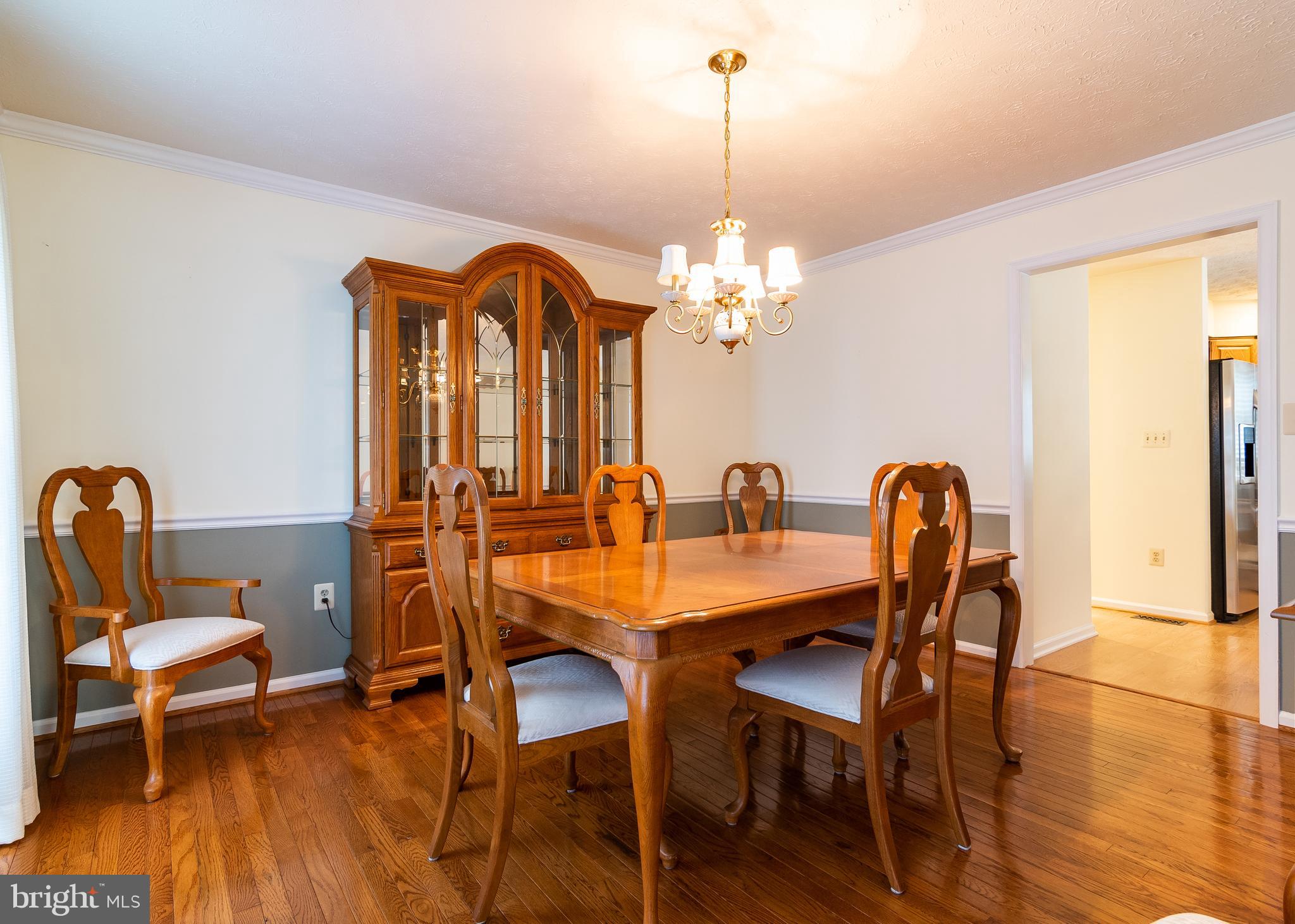 10464 Stansfield Road Laurel, MD 20723 - Photo 8 of 51 Formal dining room with chandelier