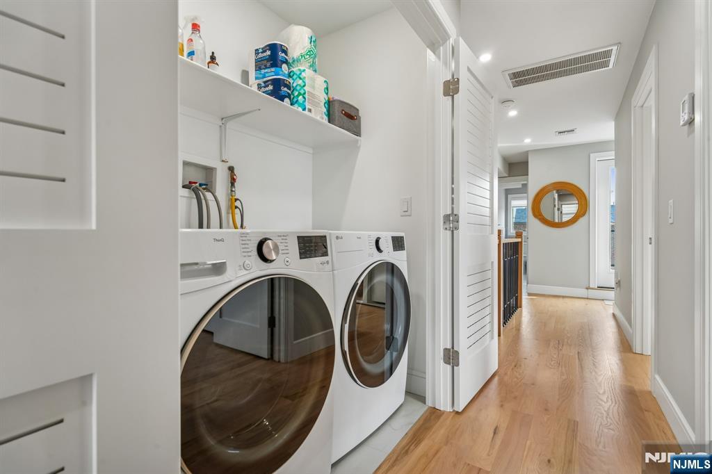 305 8th Street, Unit 2 Fairview, NJ 07022 - Photo 16 of 30 a view of washer and dryer in a laundry room