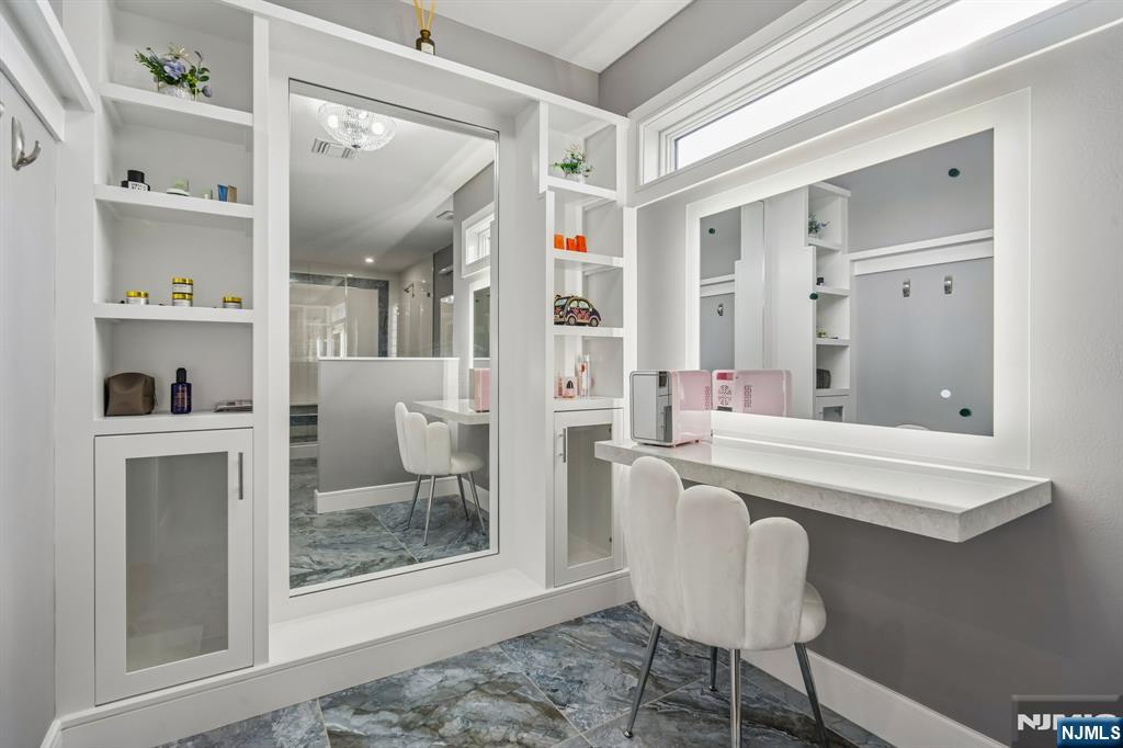 305 8th Street, Unit 2 Fairview, NJ 07022 - Photo 26 of 30 a spacious bathroom with a sink and a mirror