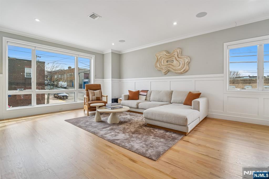 305 8th Street, Unit 2 Fairview, NJ 07022 - Photo 3 of 30 a living room with furniture and a large window
