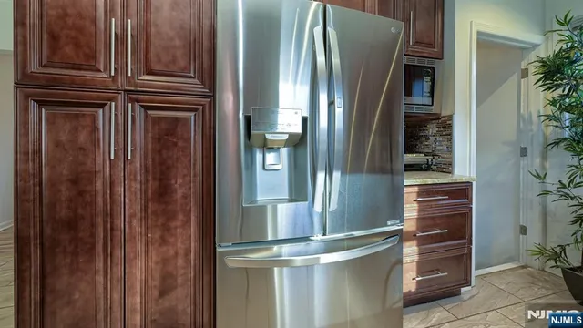 a view of a refrigerator in kitchen
