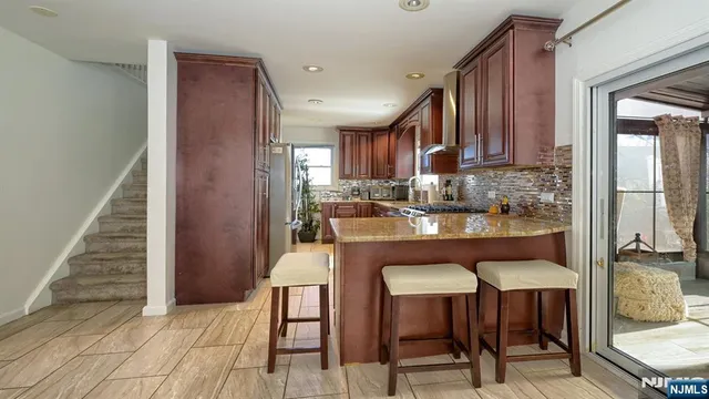 a dining room with furniture and a window