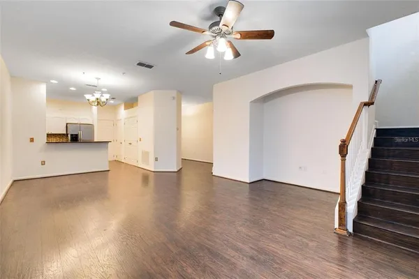 a view of a kitchen with a sink and a chandelier