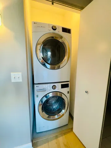 a view of a hallway with washer and dryer