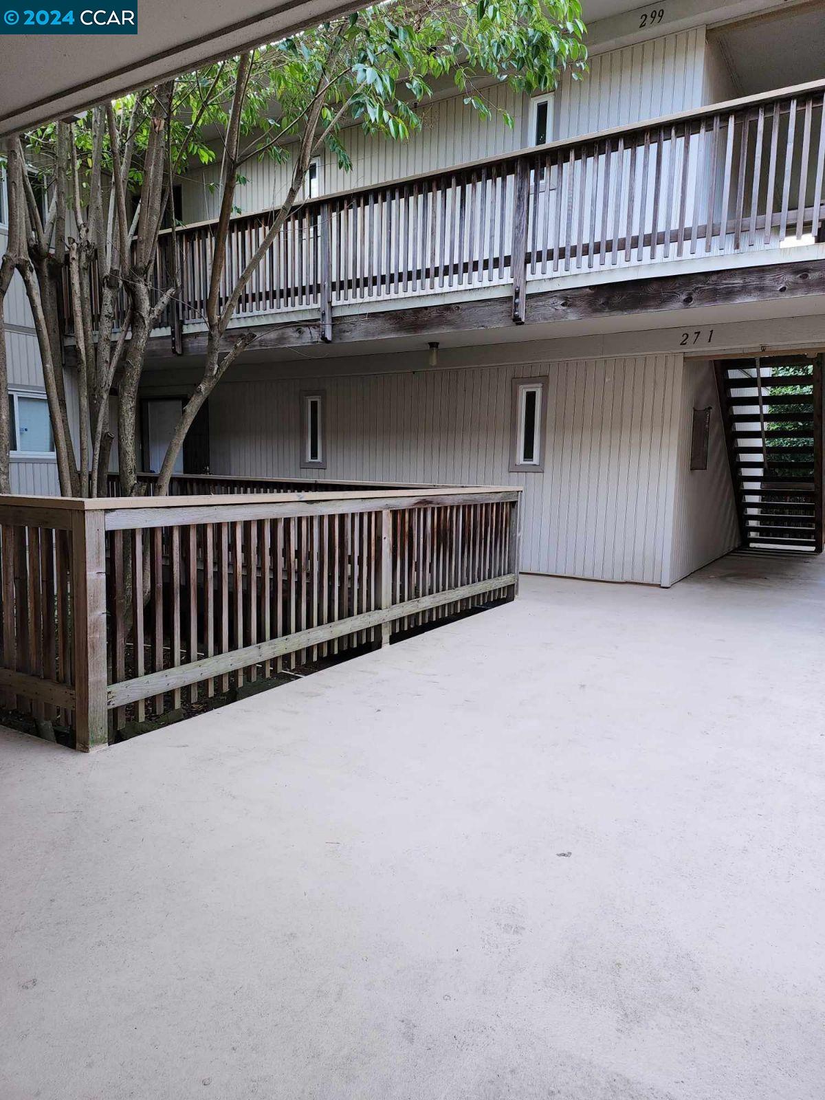 a view of a balcony with a deck