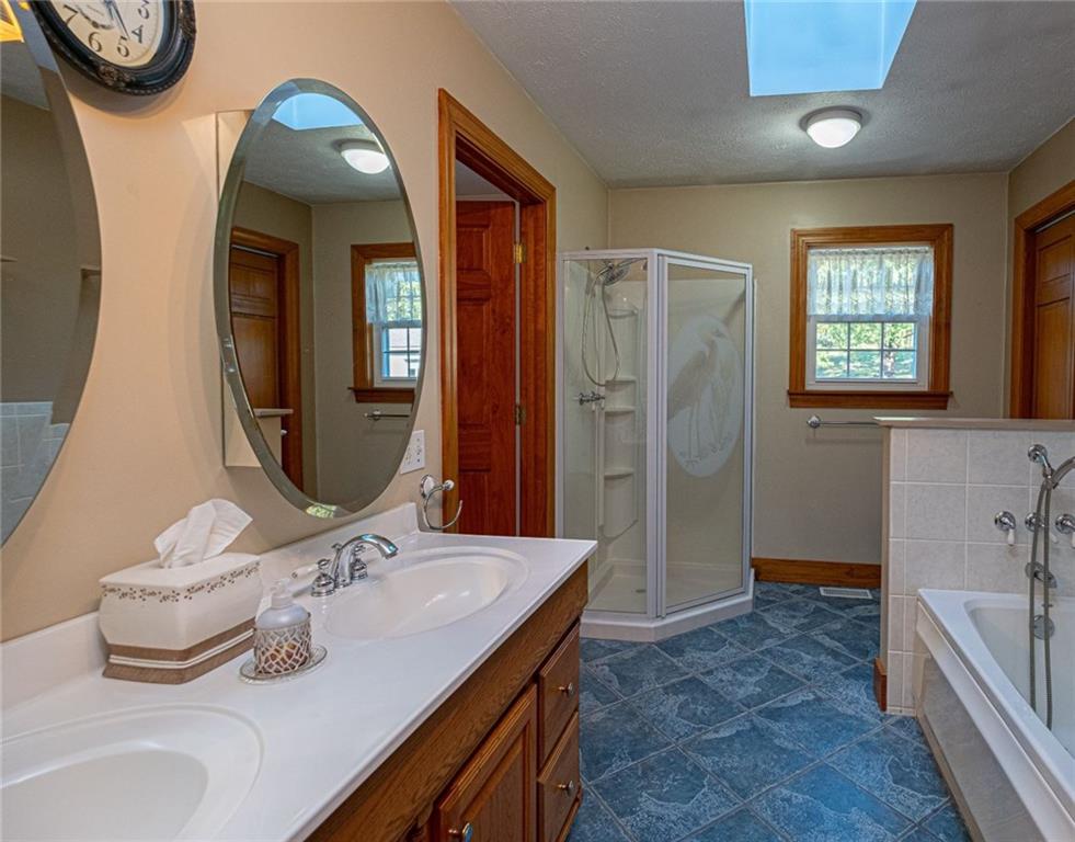 1531 Washington Road Apollo, PA 15613 - Photo 15 of 25 Master Bathroom with extra deep tub, stand-up shower, double sink, skylight and separate laundry room.