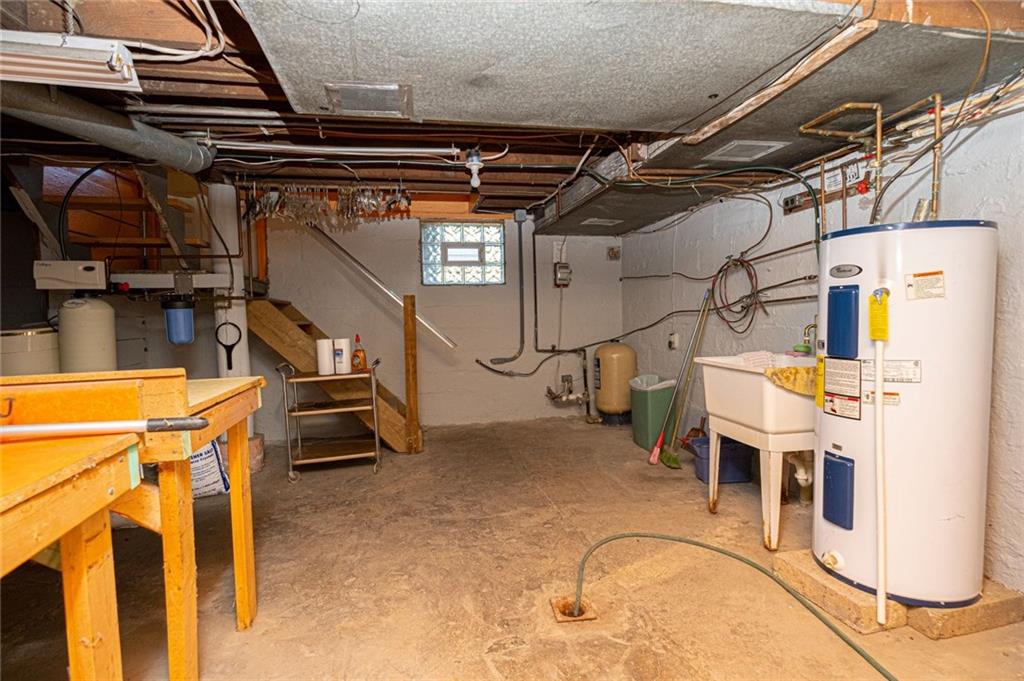 1531 Washington Road Apollo, PA 15613 - Photo 22 of 25 Half of the basement with the owned Culligan water softener system.