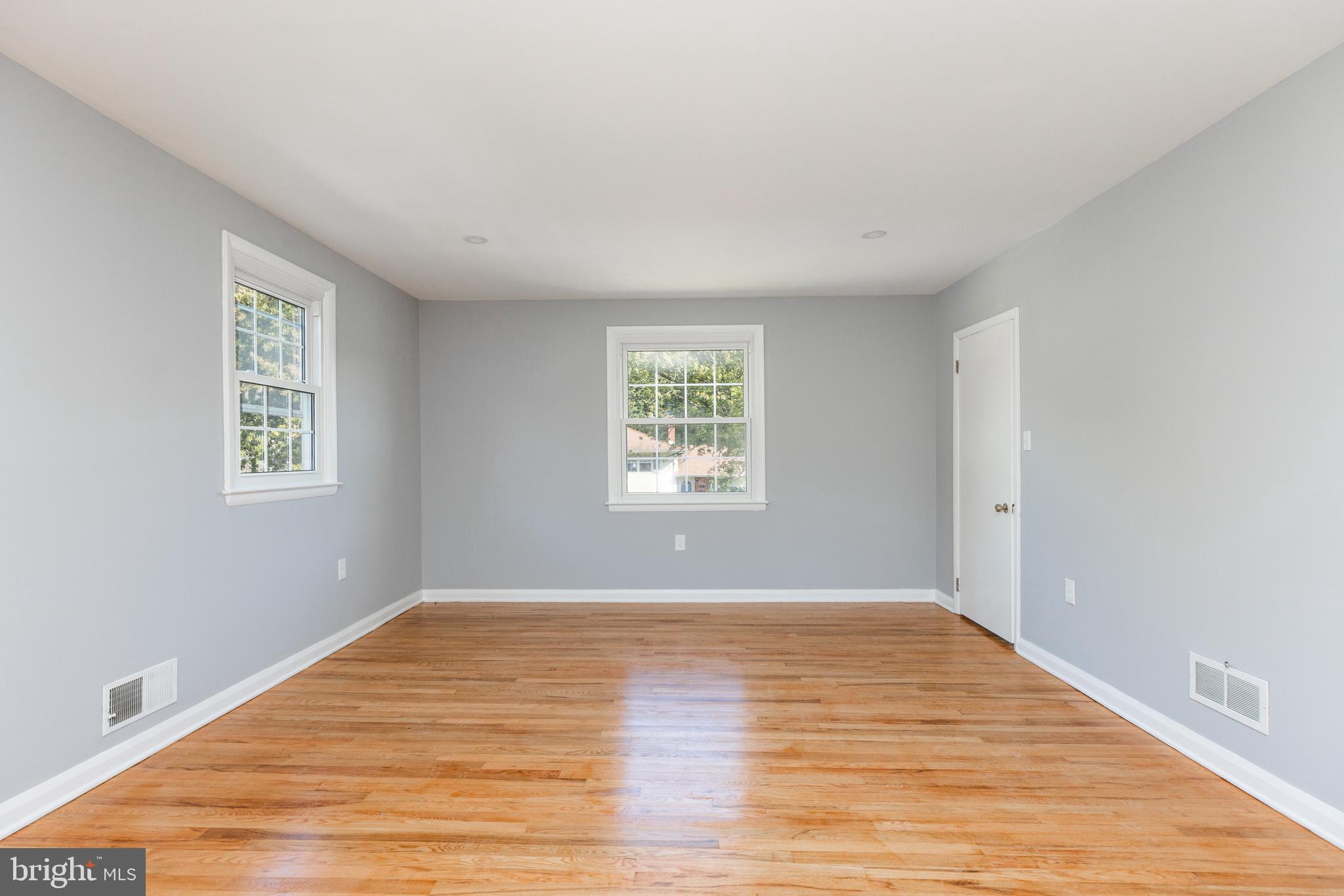 2404 2404-rambler Rambler Road Wilmington, DE 19810 - Photo 12 of 28 a view of an empty room with wooden floor and a window