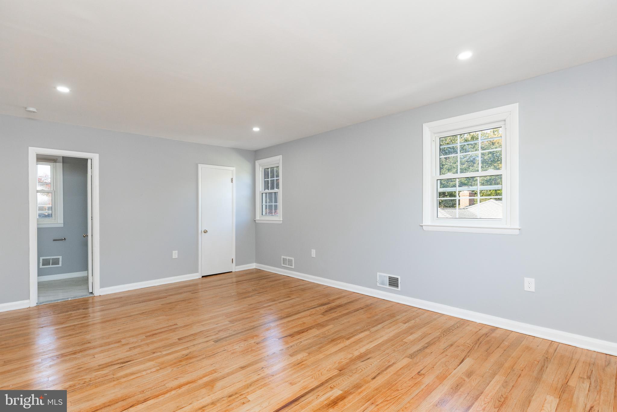 2404 2404-rambler Rambler Road Wilmington, DE 19810 - Photo 13 of 28 a view of an empty room with wooden floor and a window