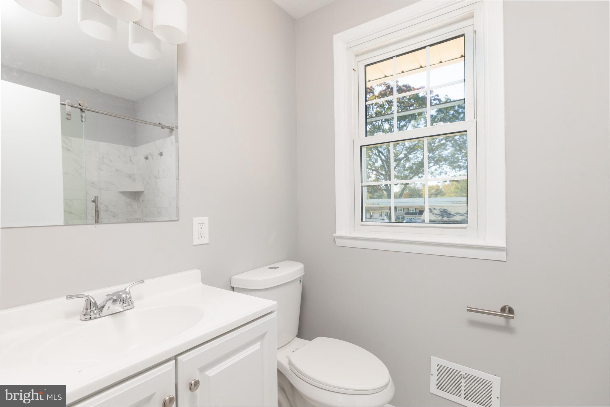 2404 2404-rambler Rambler Road Wilmington, DE 19810 - Photo 15 of 28 a white toilet sitting next to a bathroom sink