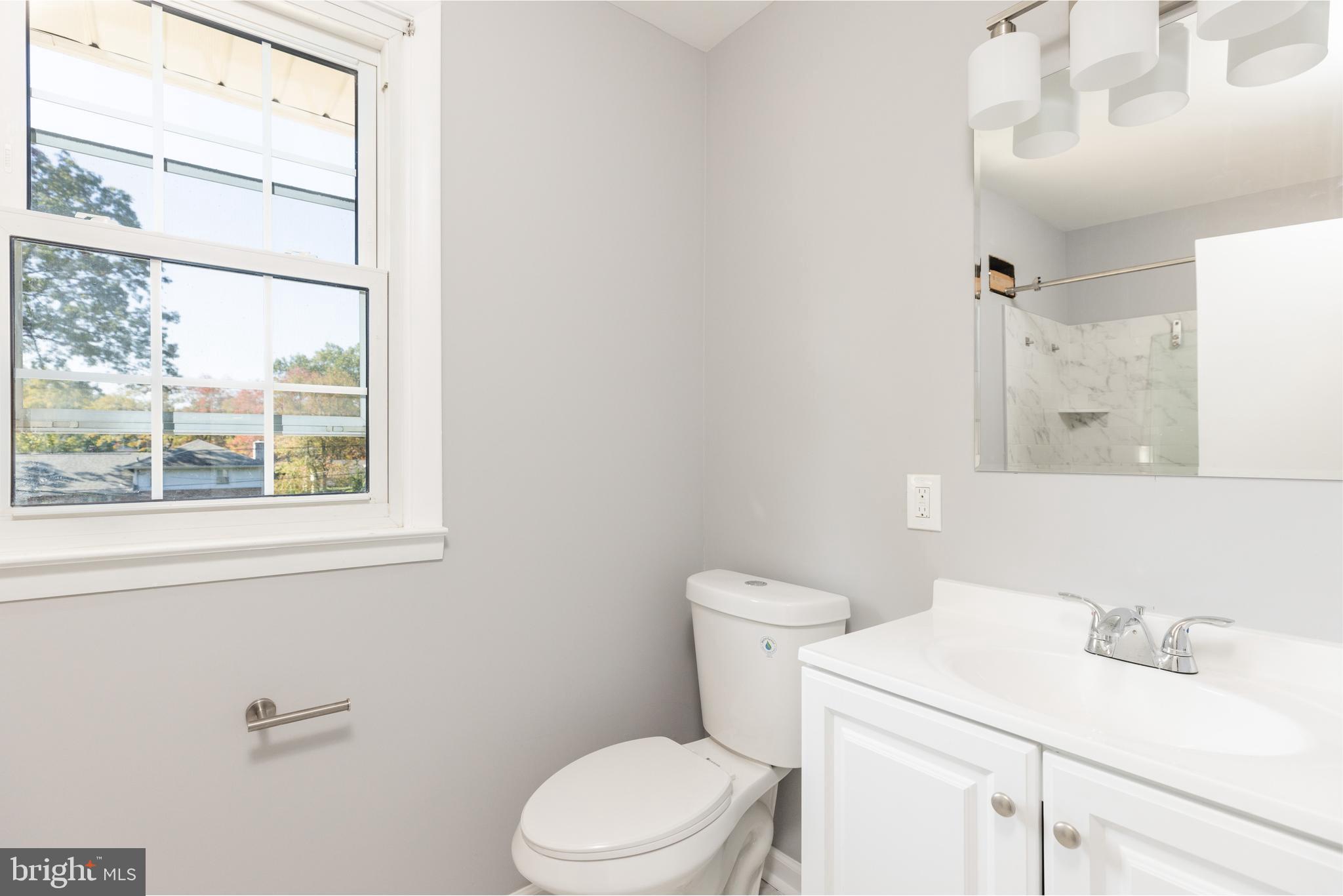 2404 2404-rambler Rambler Road Wilmington, DE 19810 - Photo 16 of 28 a bathroom with a sink a toilet and a window
