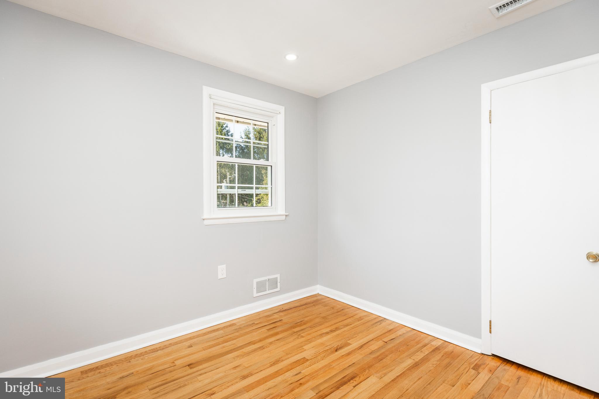 2404 2404-rambler Rambler Road Wilmington, DE 19810 - Photo 19 of 28 a view of an empty room with wooden floor and a window