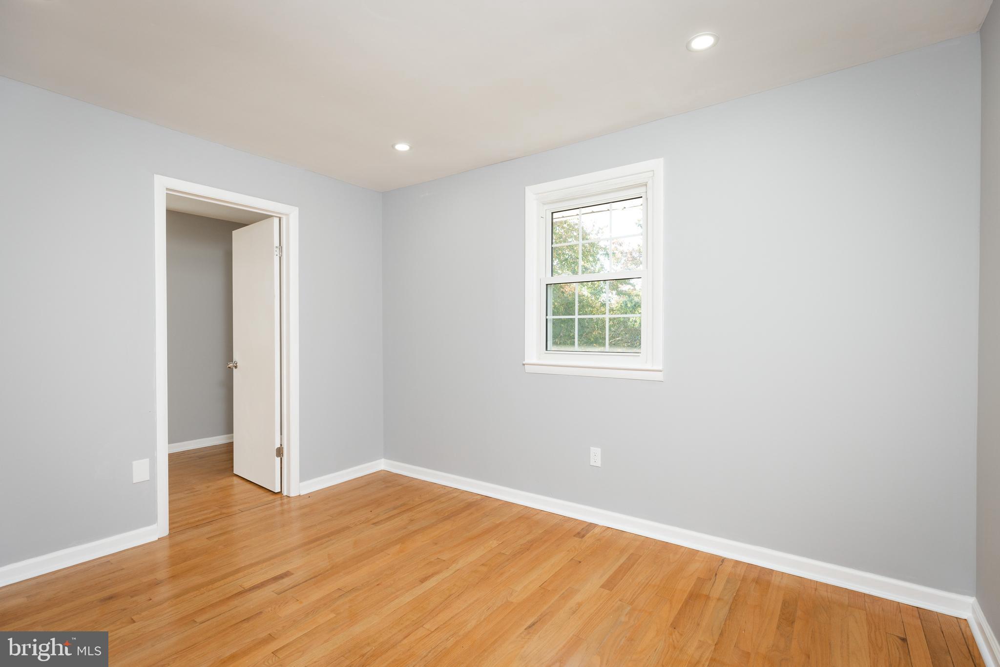 2404 2404-rambler Rambler Road Wilmington, DE 19810 - Photo 24 of 28 an empty room with wooden floor and windows