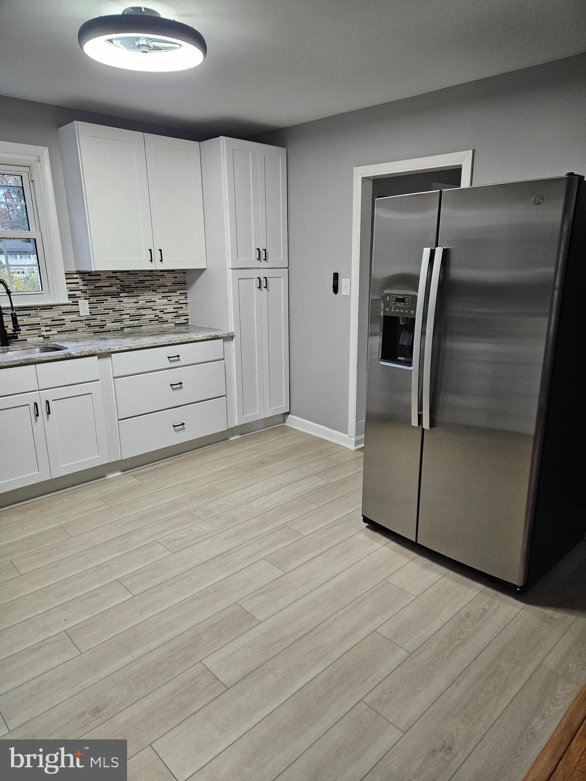 2404 2404-rambler Rambler Road Wilmington, DE 19810 - Photo 5 of 28 a kitchen with granite countertop a refrigerator and a stove