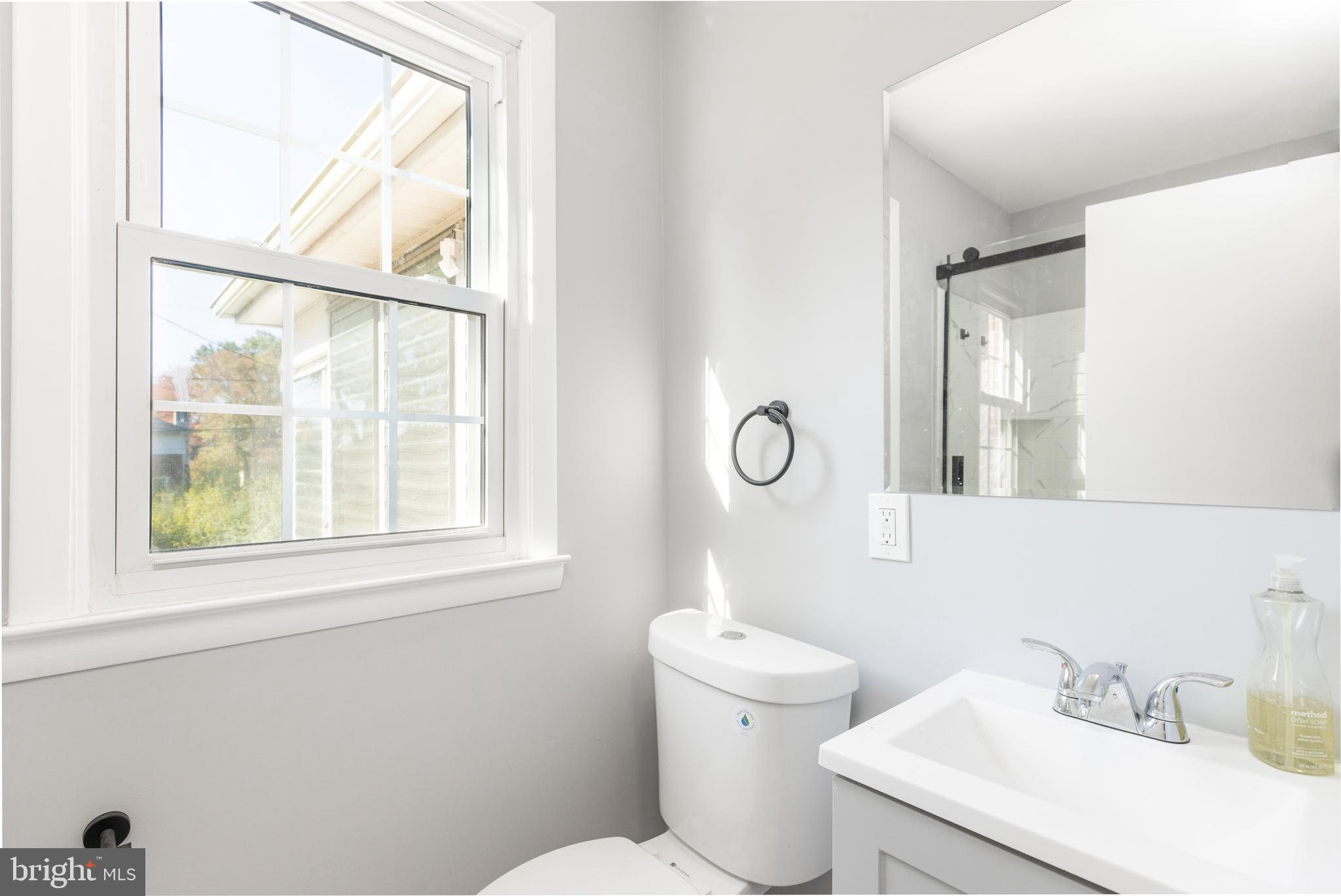 2404 2404-rambler Rambler Road Wilmington, DE 19810 - Photo 8 of 28 a bathroom with a sink mirror and a toilet