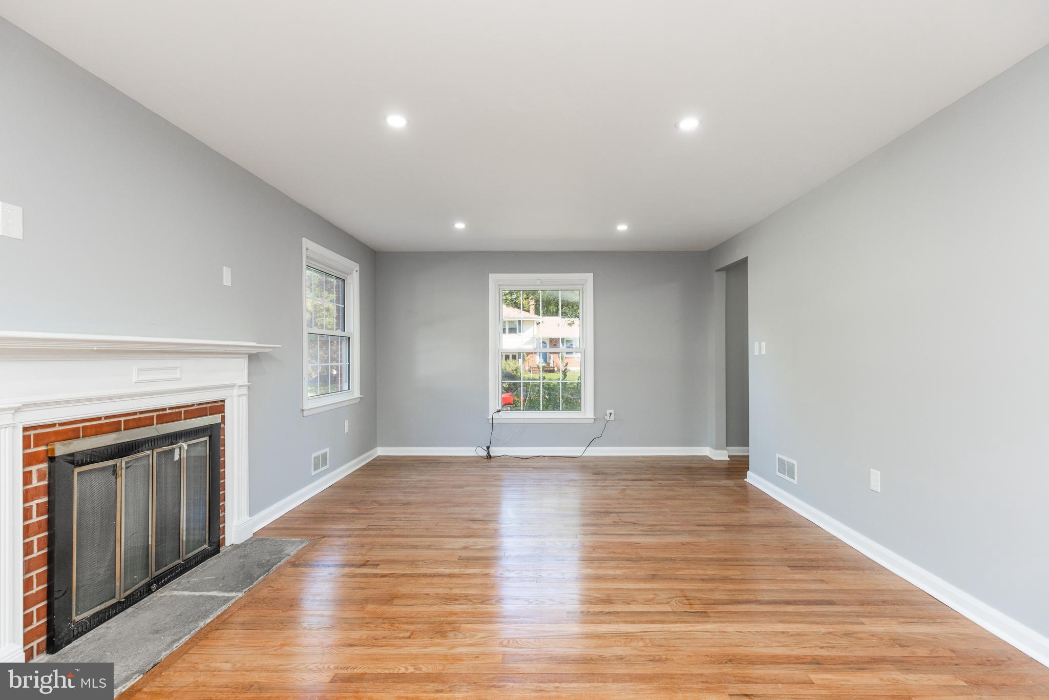2404 2404-rambler Rambler Road Wilmington, DE 19810 - Photo 9 of 28 a view of an empty room with wooden floor and a window