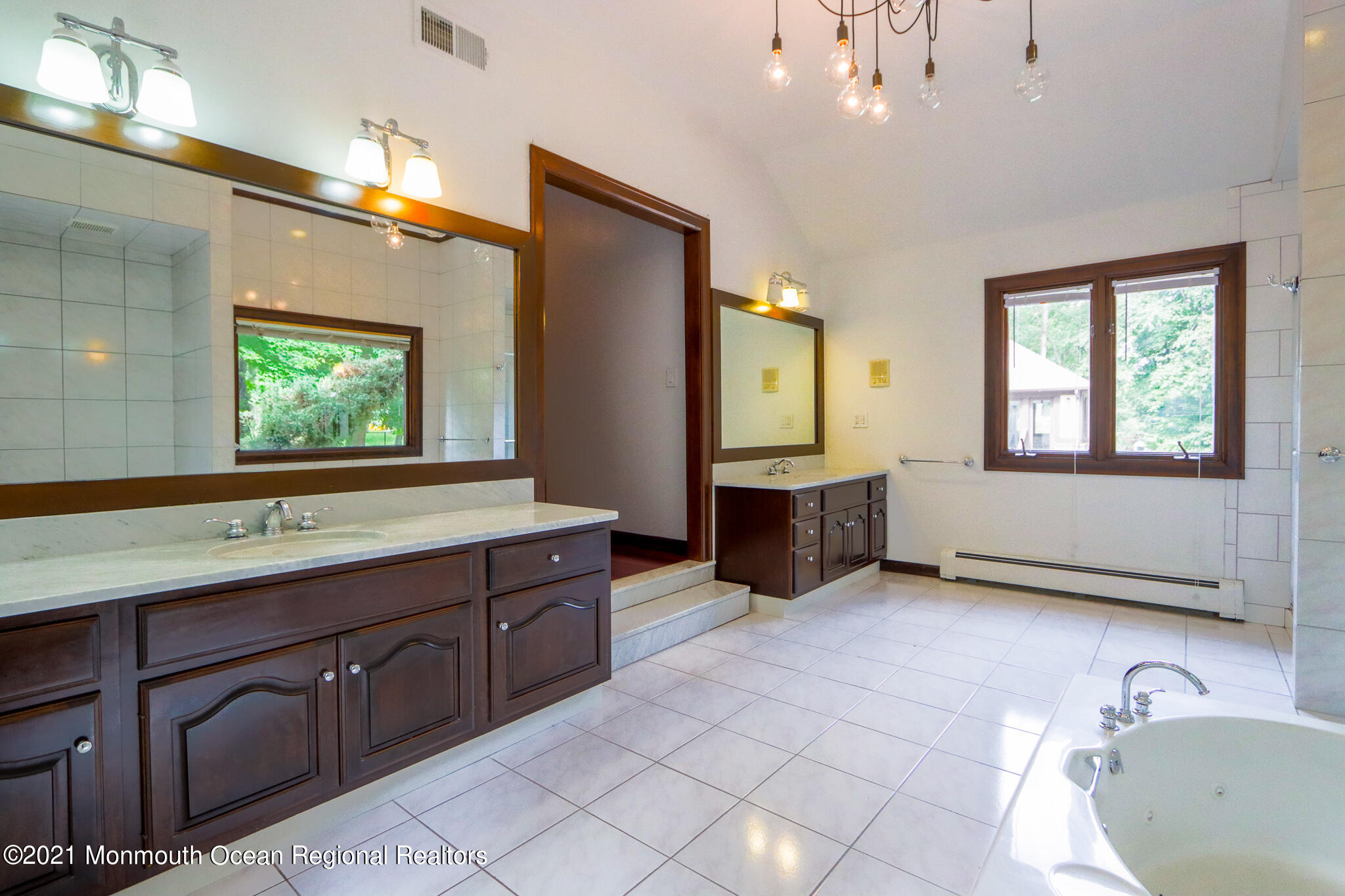 7 Perrine Circle Millstone Township, NJ 08535 - Photo 13 of 27 a spacious bathroom with a tub sink and mirror