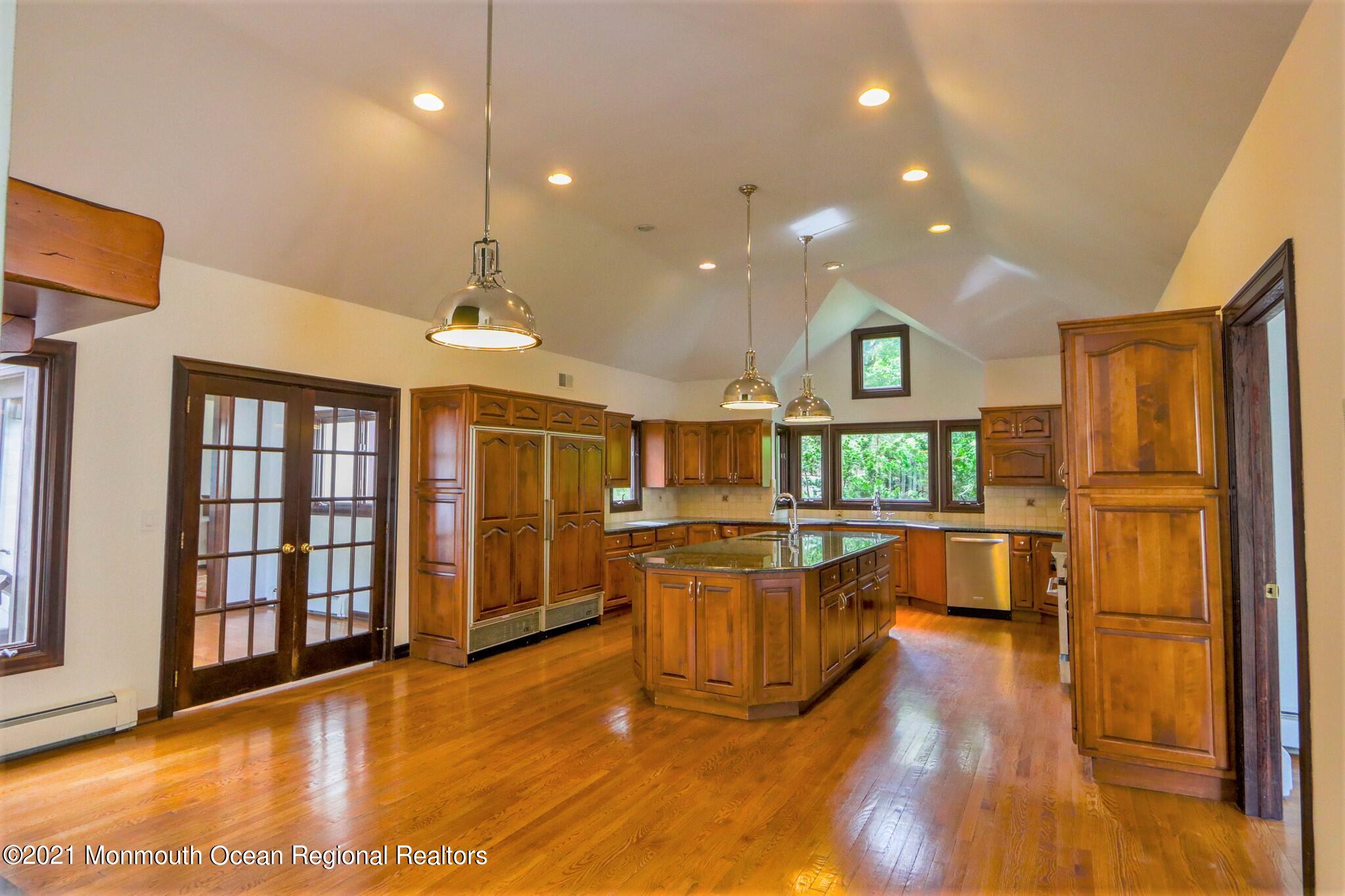 7 Perrine Circle Millstone Township, NJ 08535 - Photo 15 of 27 a view of large kitchen with stainless steel appliances wooden floor and large window