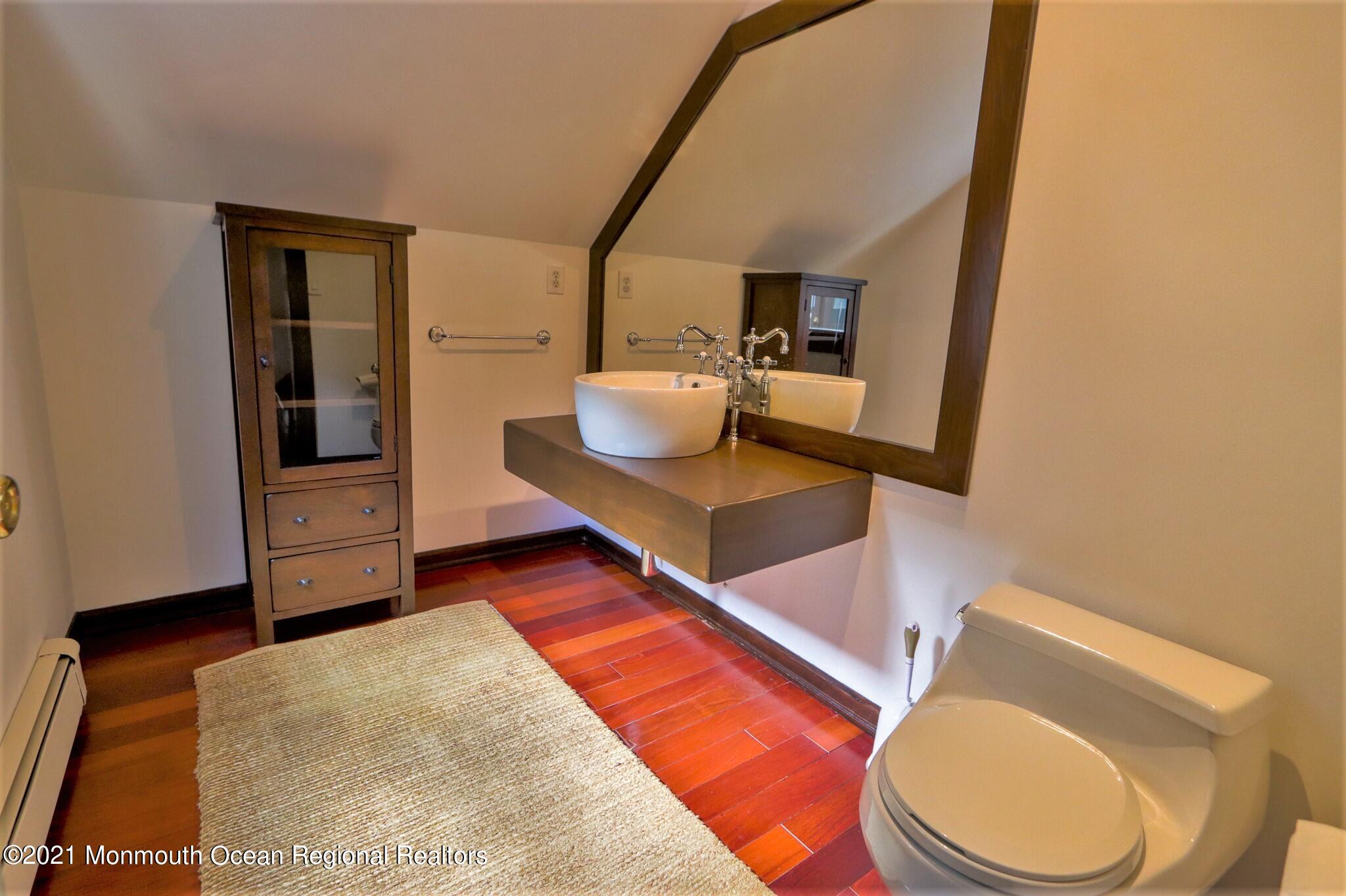 7 Perrine Circle Millstone Township, NJ 08535 - Photo 20 of 27 a bathroom with a toilet and a sink