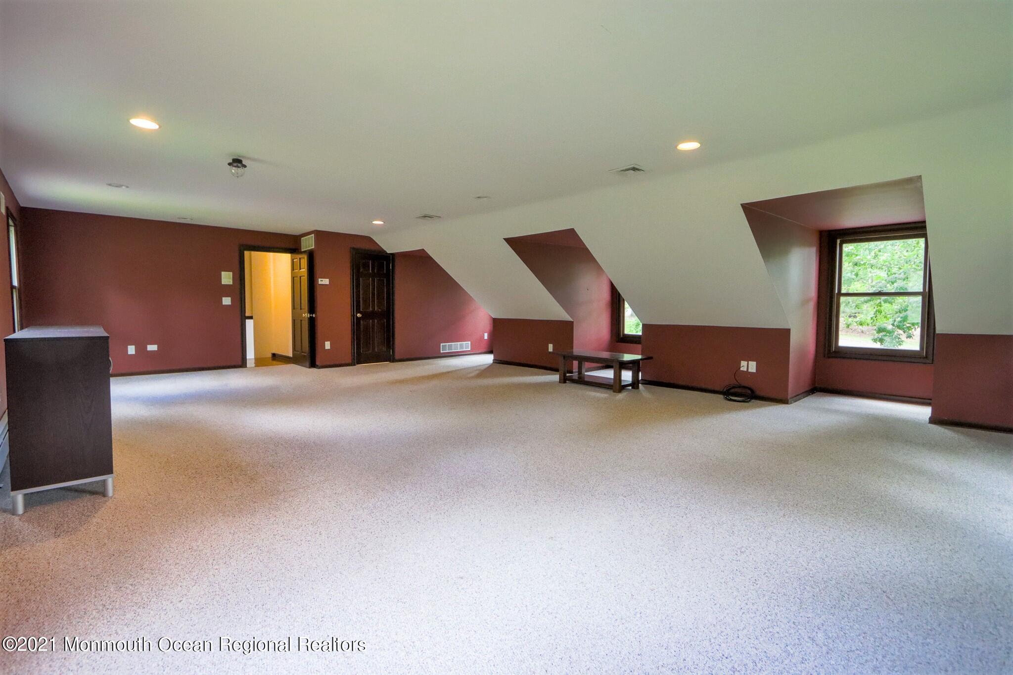 7 Perrine Circle Millstone Township, NJ 08535 - Photo 22 of 27 a view of a livingroom with furniture and windows