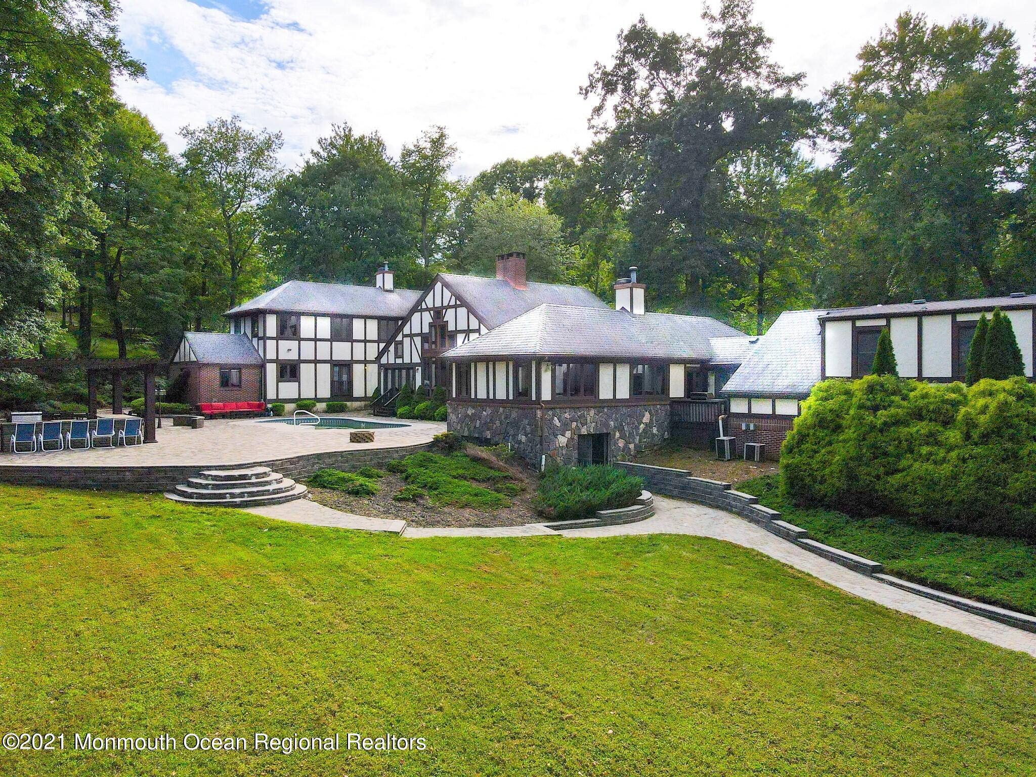 7 Perrine Circle Millstone Township, NJ 08535 - Photo 27 of 27 a front view of a house with swimming pool having outdoor seating